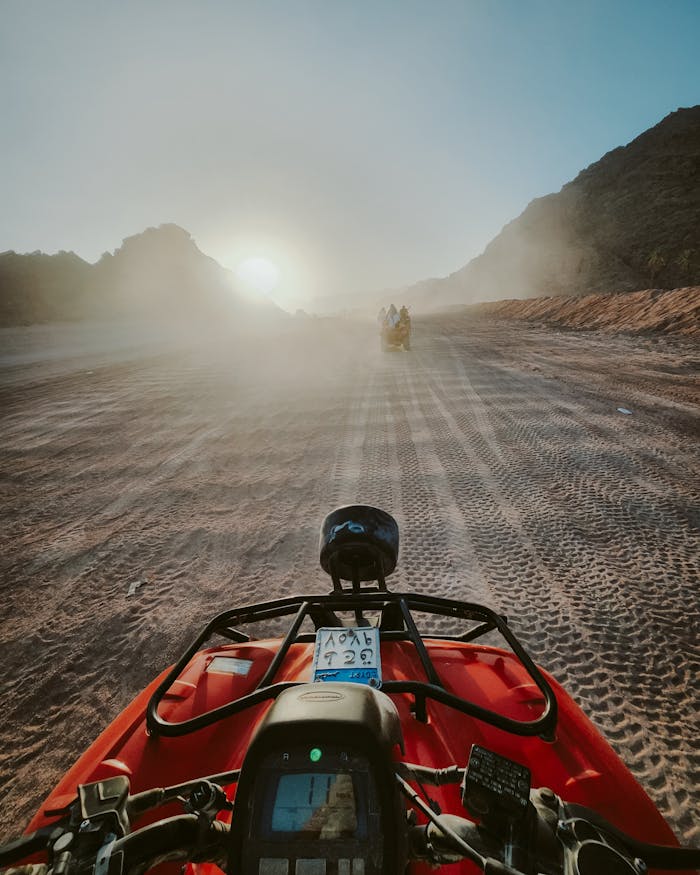 Explore the excitement of an ATV ride through the desert dunes of Sharm El-Sheikh at sunrise.